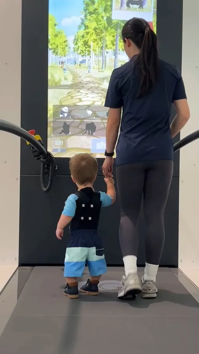 Child using the Motek C-Mill VR treadmill for gait and balance training at Aevum paediatric physiotherapy, Sutherland Shire